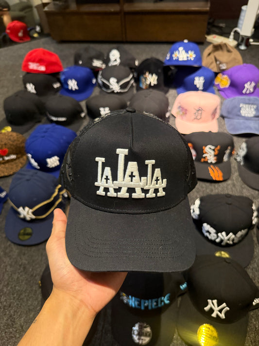 LA RUDE AWAKENINGS TRUCKER HAT