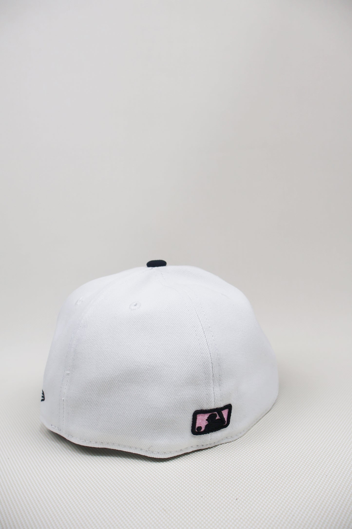 A TWO TONE PINK UB FITTED HAT