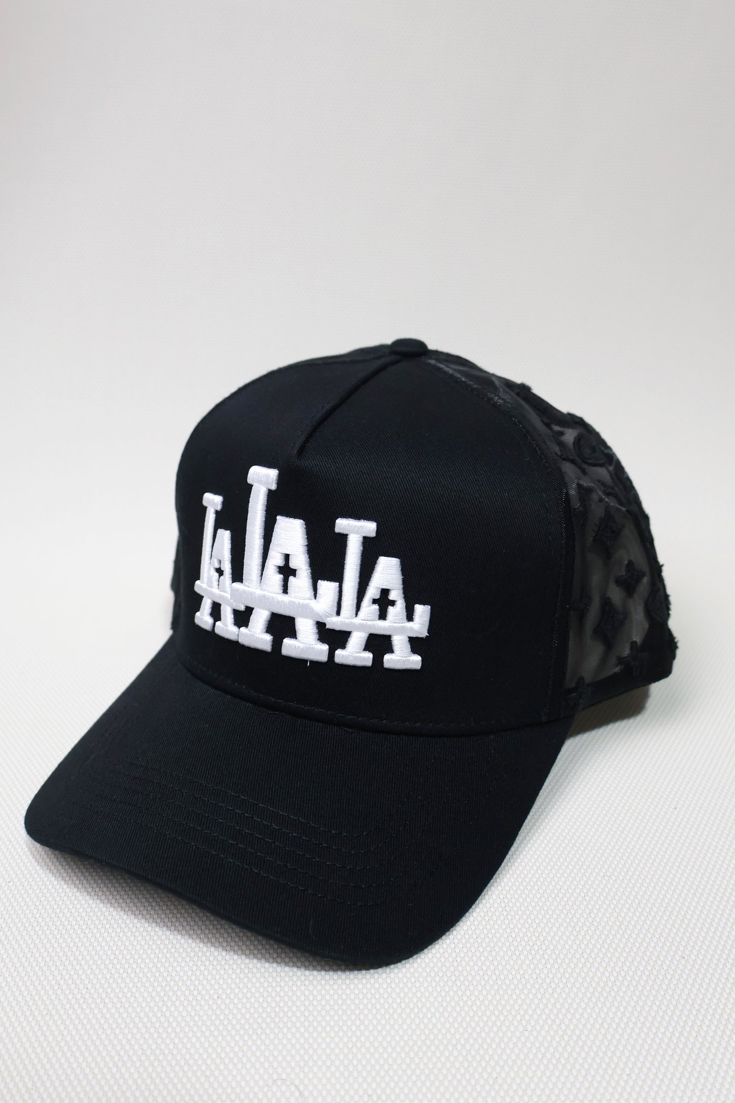 LA RUDE AWAKENING TRUCKER HAT
