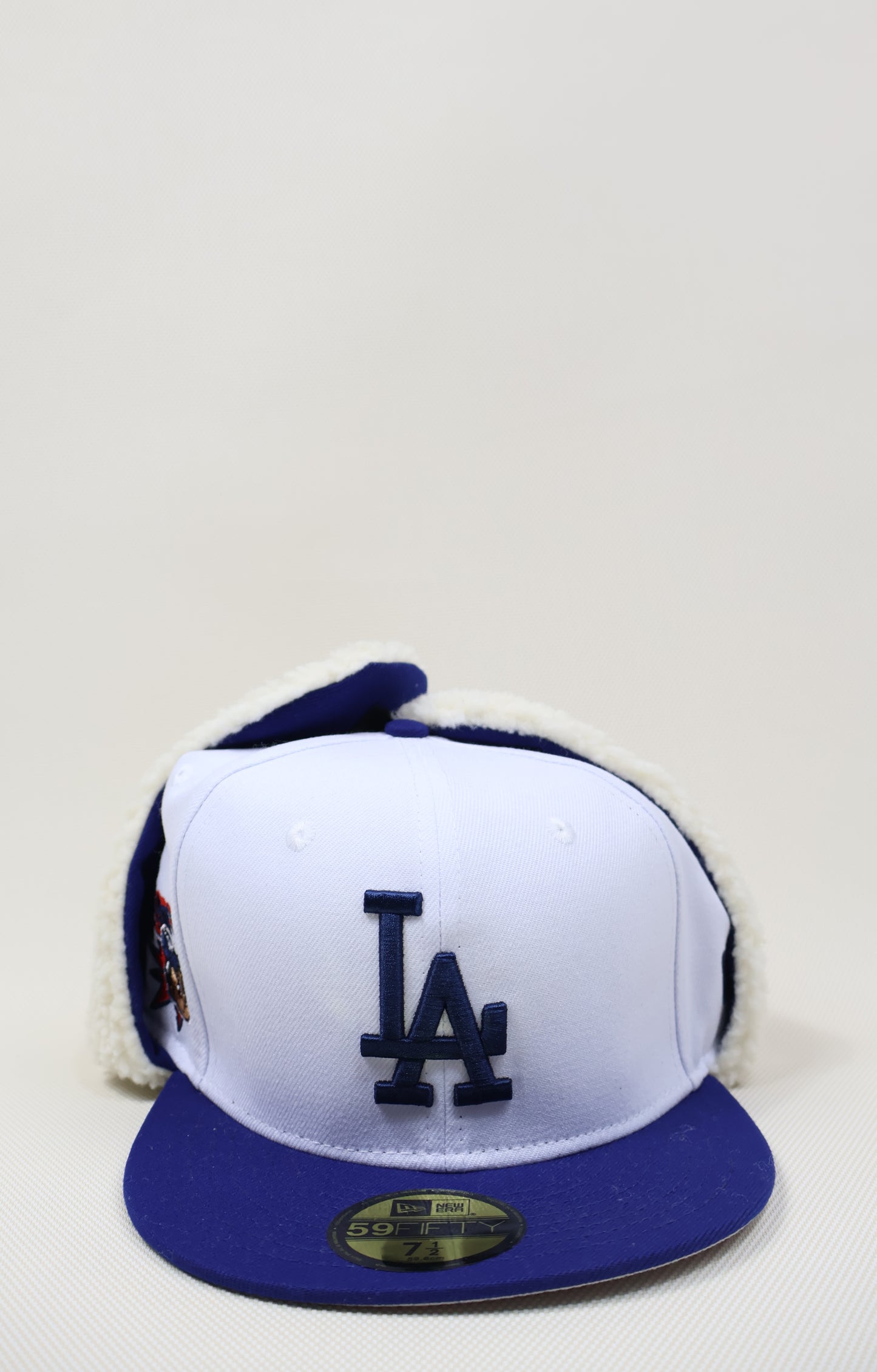 LA SNOW EAR MUFFS FITTED HAT