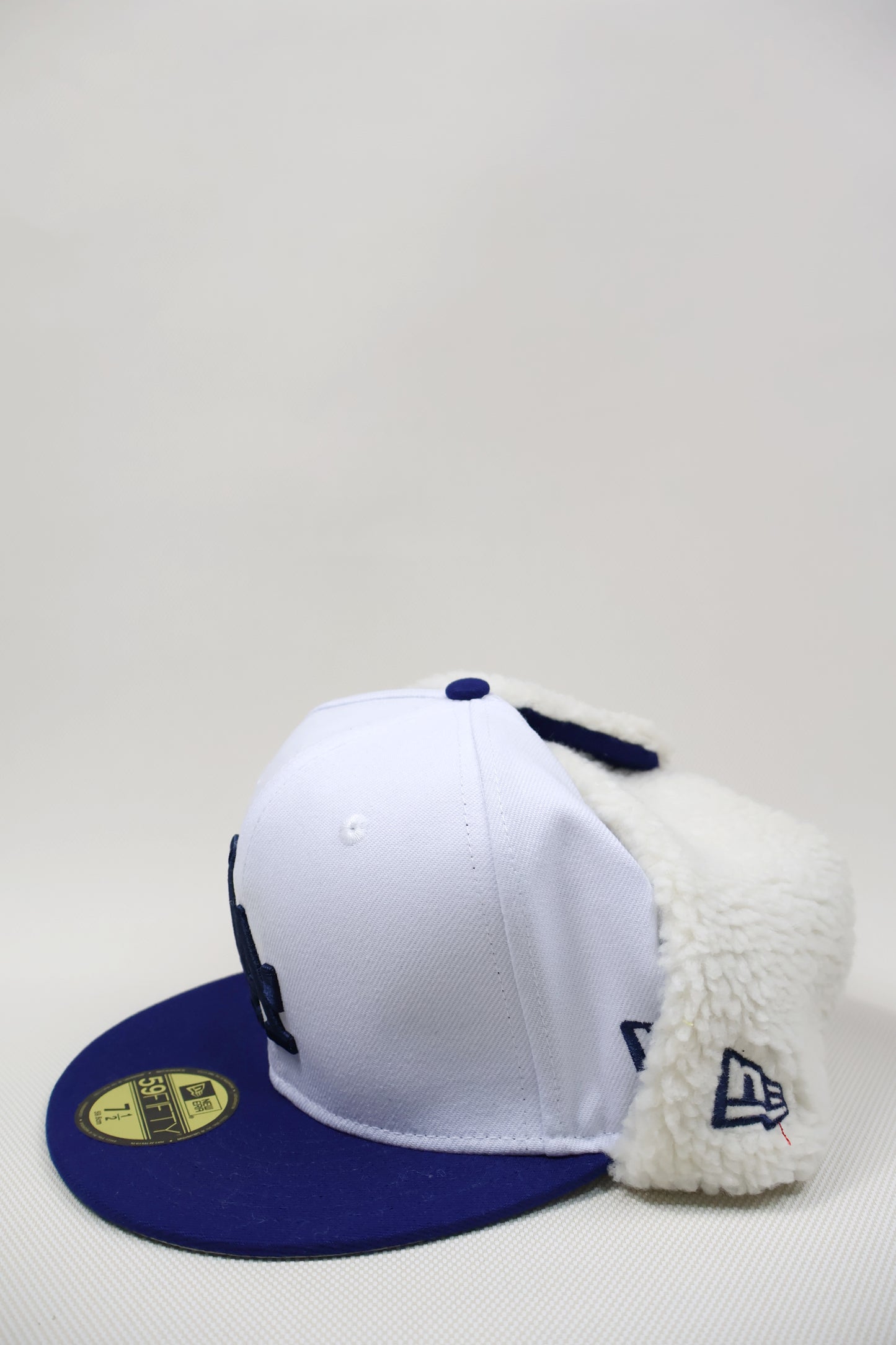 LA SNOW EAR MUFFS FITTED HAT