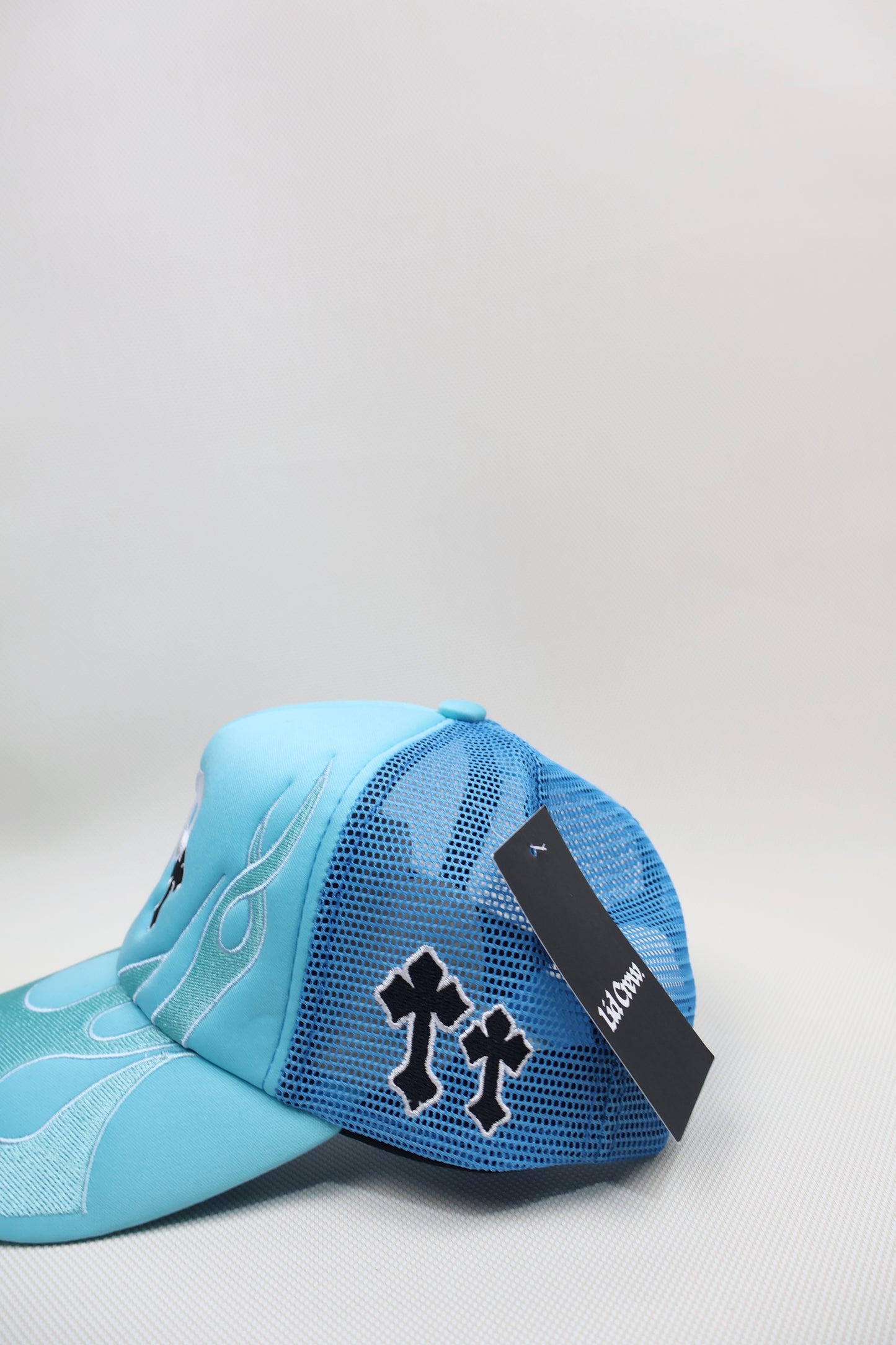 P BABY BLUE FLAMES TRUCKER HAT