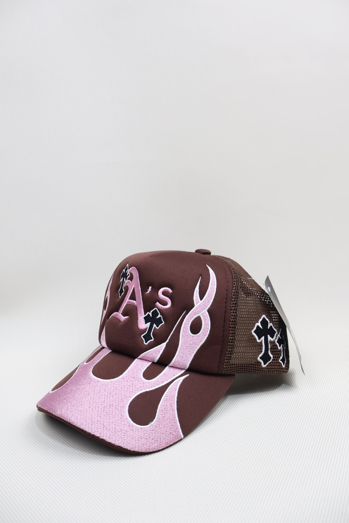 A PINK FLAMES TRUCKER HAT