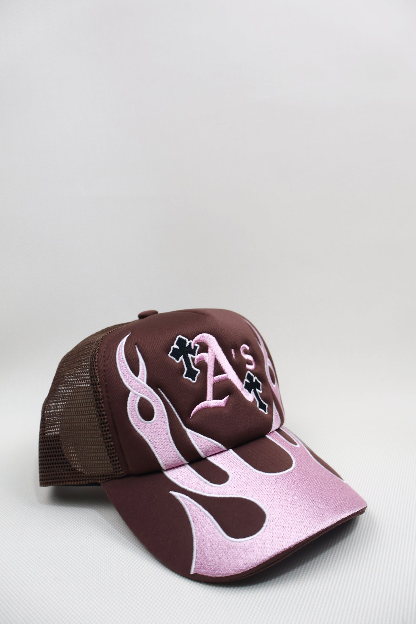 A PINK FLAMES TRUCKER HAT