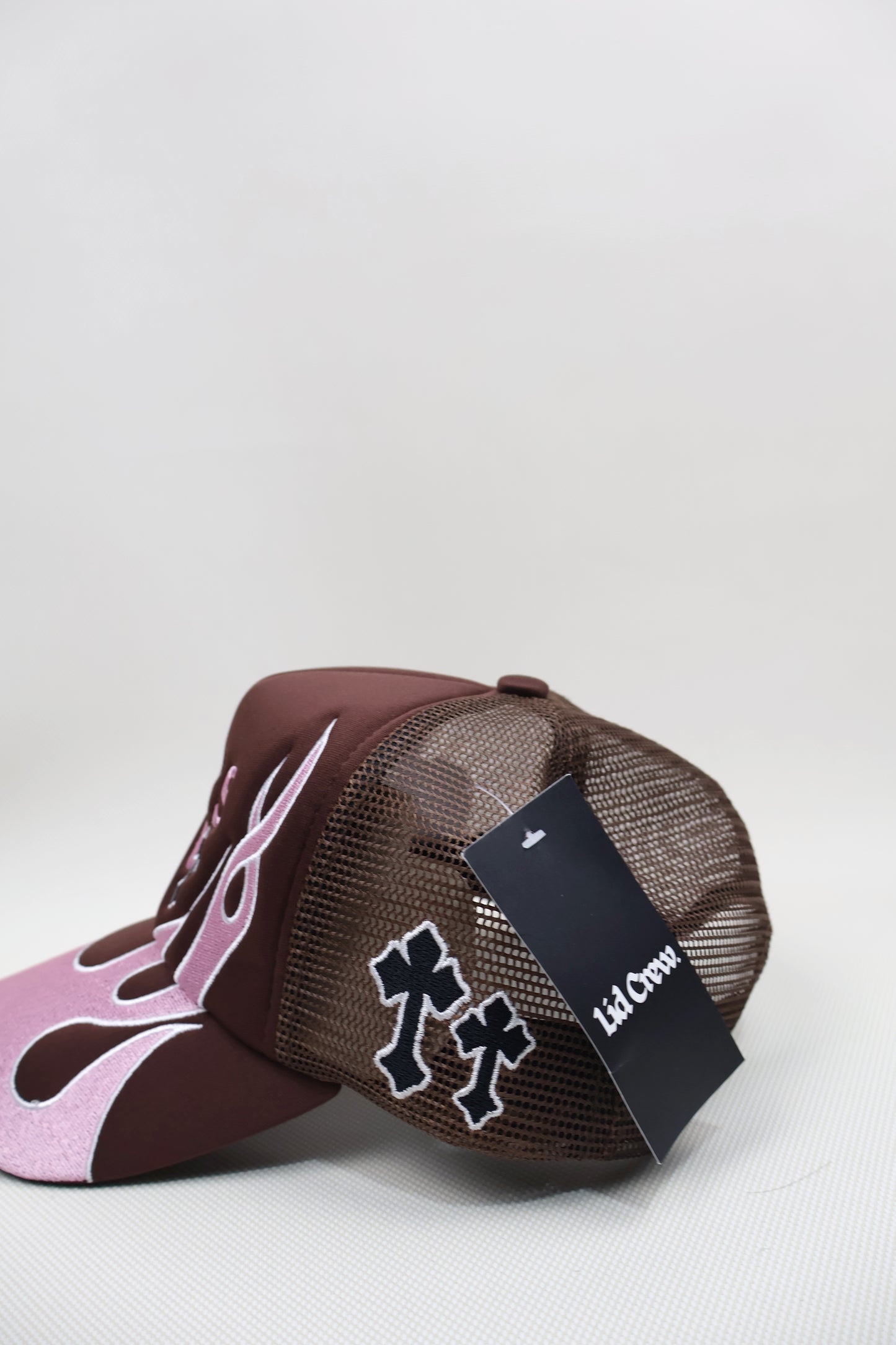 A PINK FLAMES TRUCKER HAT