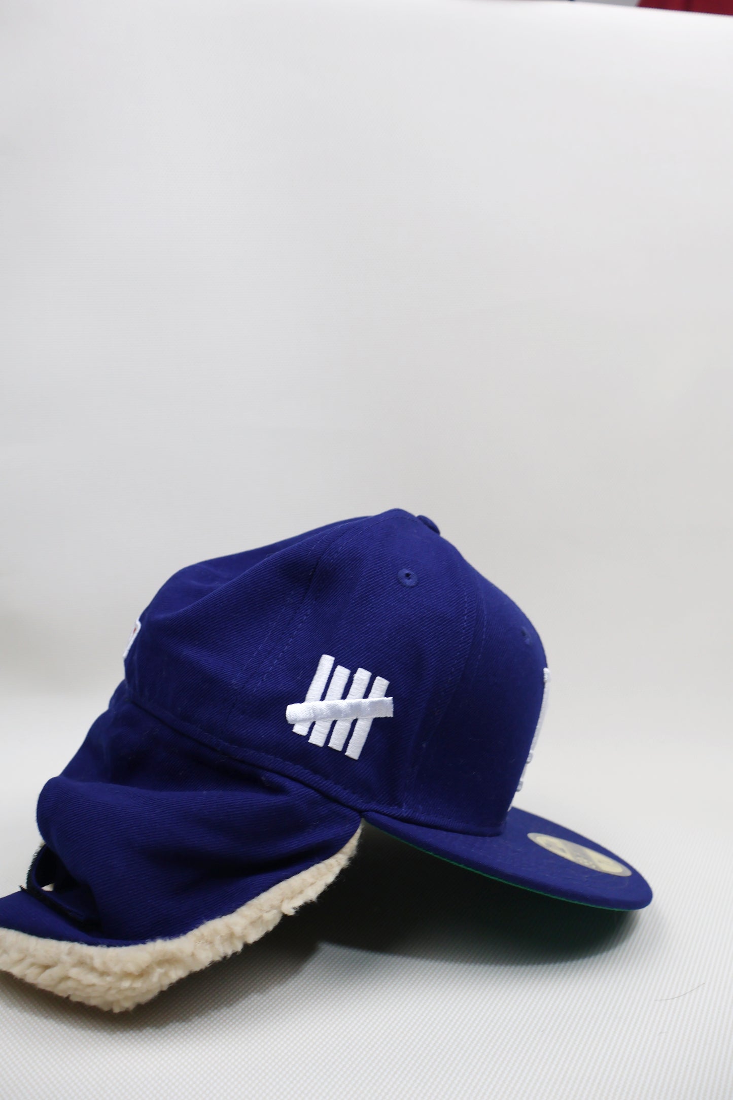 LA UNDEFEATED EAR MUFFS FITTED HAT