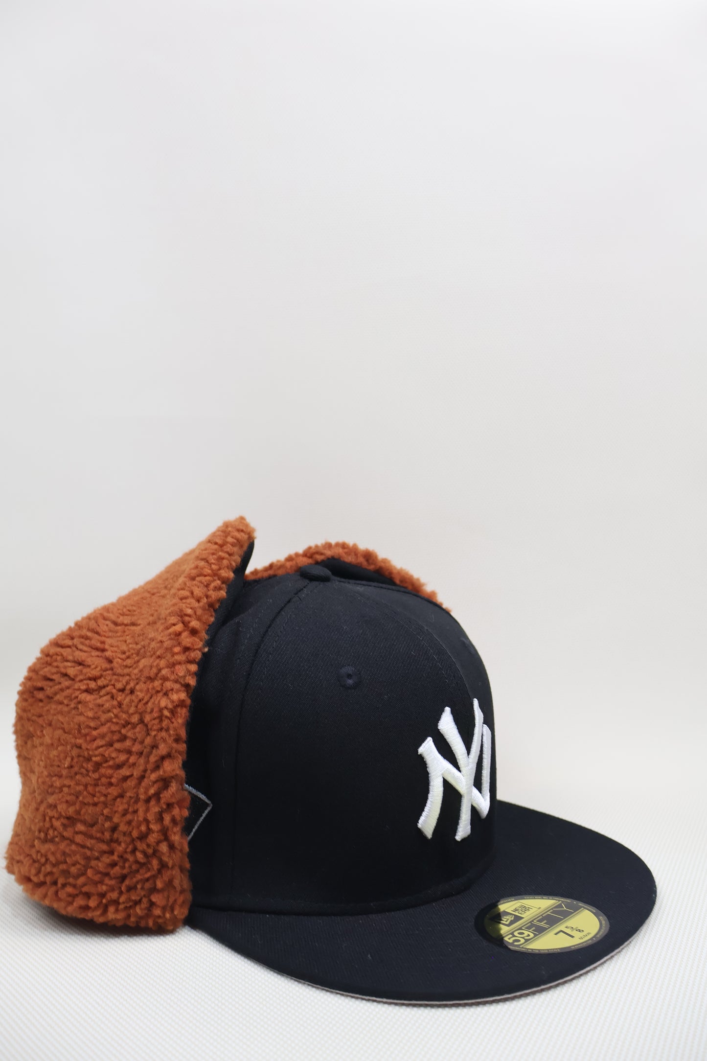 NY MULTI PATCH EAR MUFFS FITTED HAT