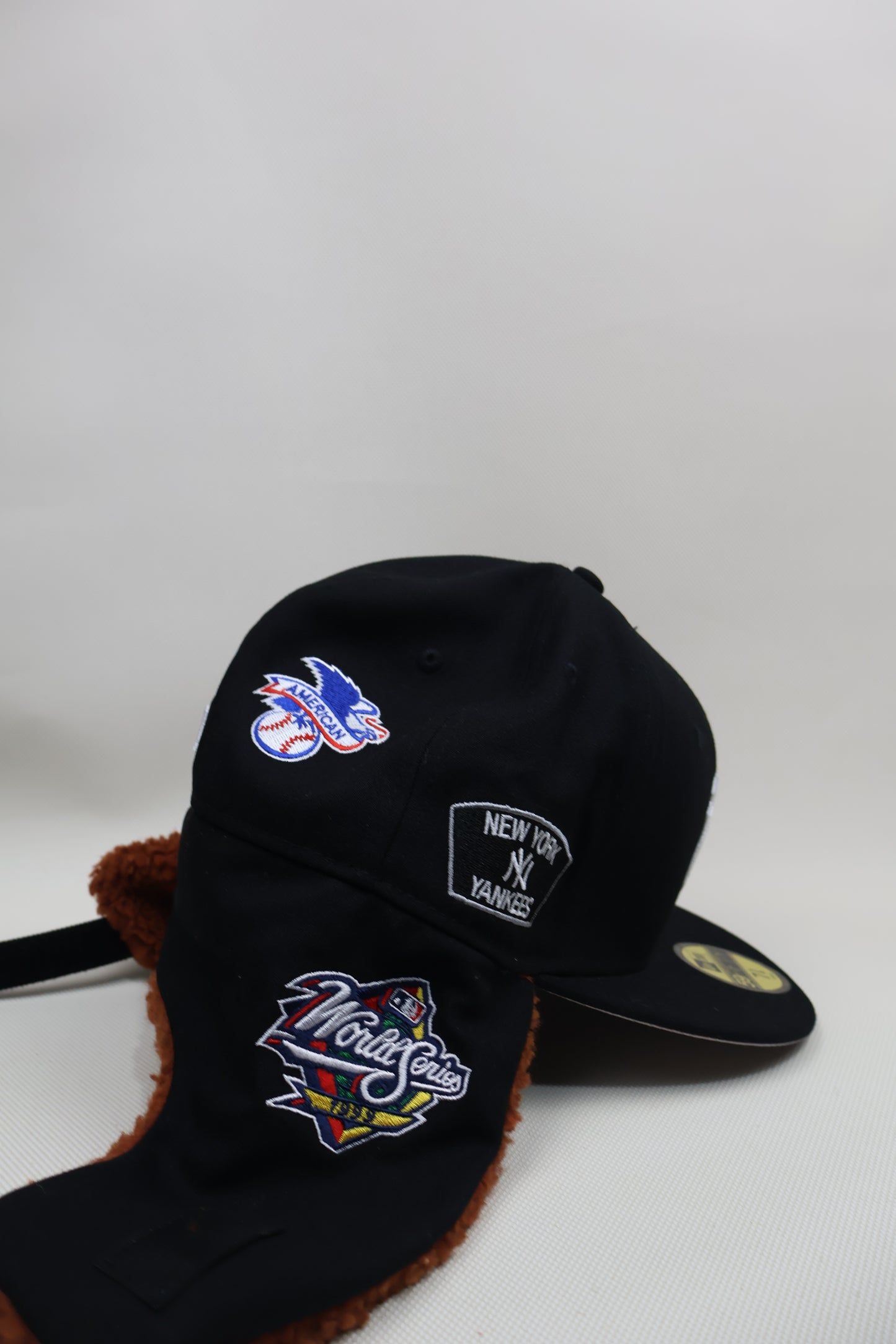 NY MULTI PATCH EAR MUFFS FITTED HAT