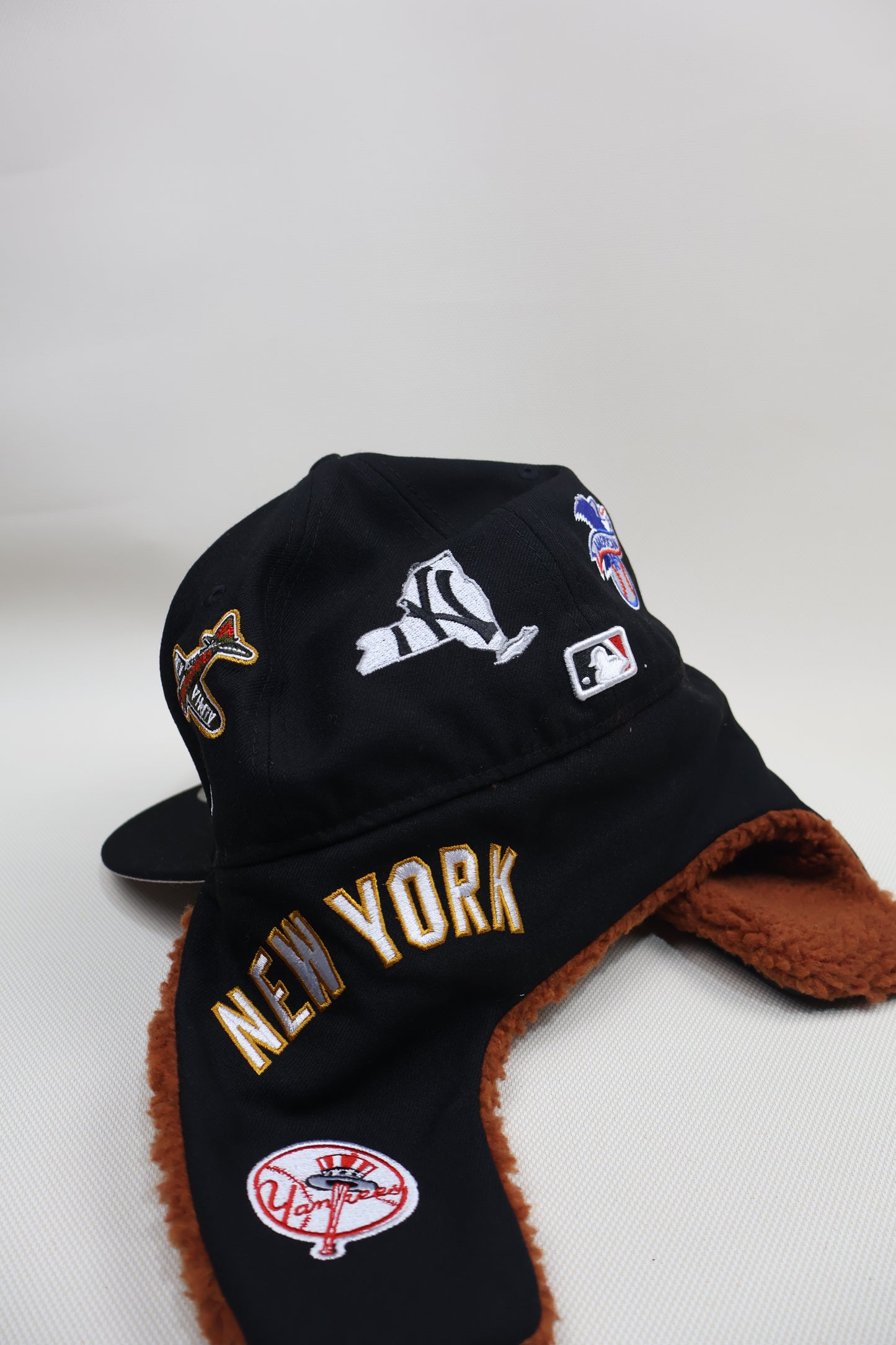 NY MULTI PATCH EAR MUFFS FITTED HAT