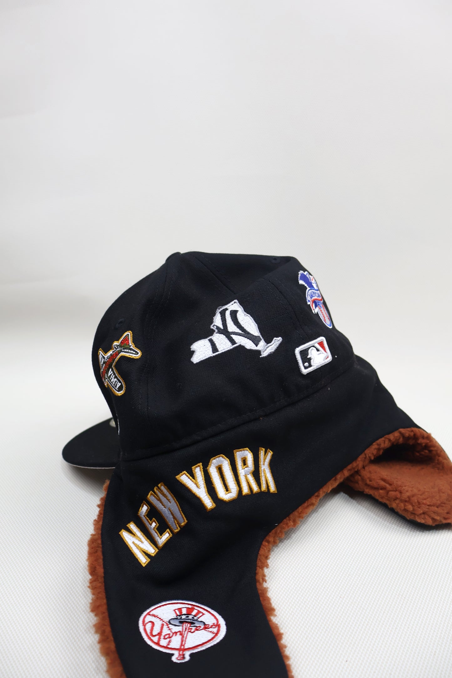 NY MULTI PATCH EAR MUFFS FITTED HAT