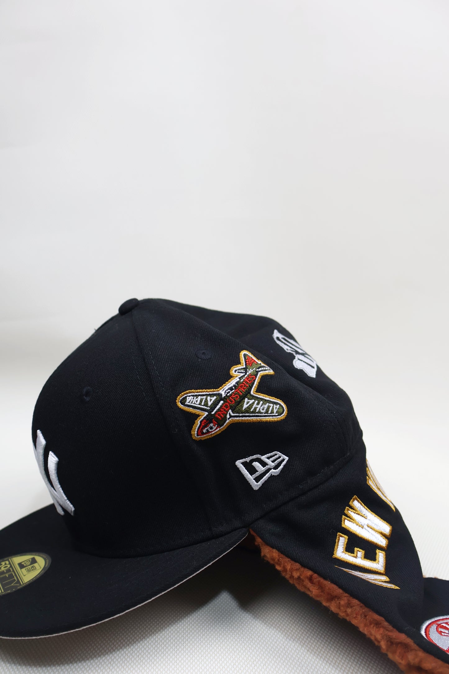 NY MULTI PATCH EAR MUFFS FITTED HAT